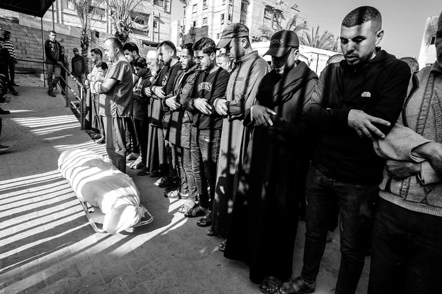 Palestinians mourn over the dead bodies after Israeli attacks in Gaza on Easter Sunday 2025